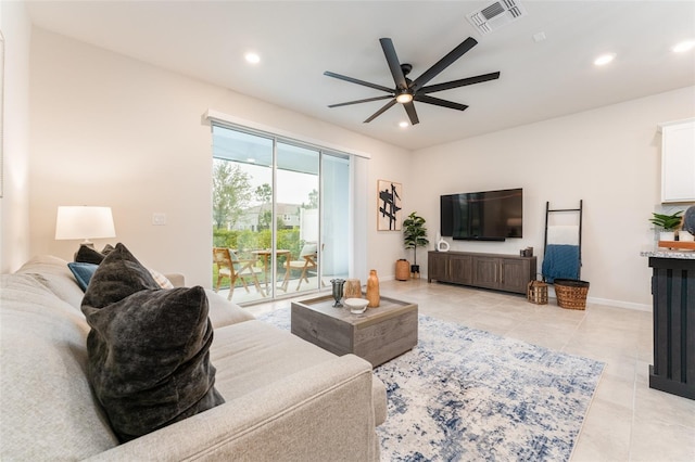 living area featuring recessed lighting, visible vents, baseboards, and light tile patterned flooring