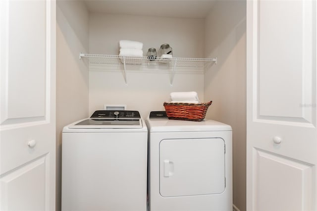 clothes washing area with laundry area and independent washer and dryer