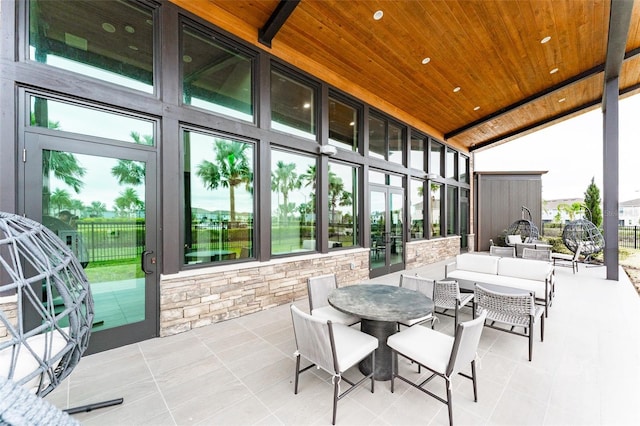 exterior space with lofted ceiling and wooden ceiling