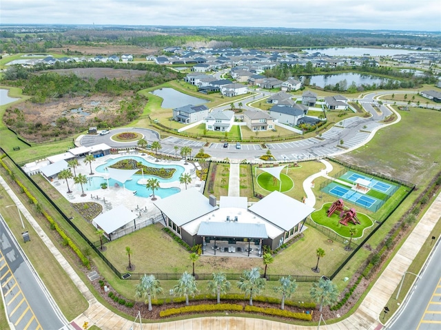 birds eye view of property with a water view