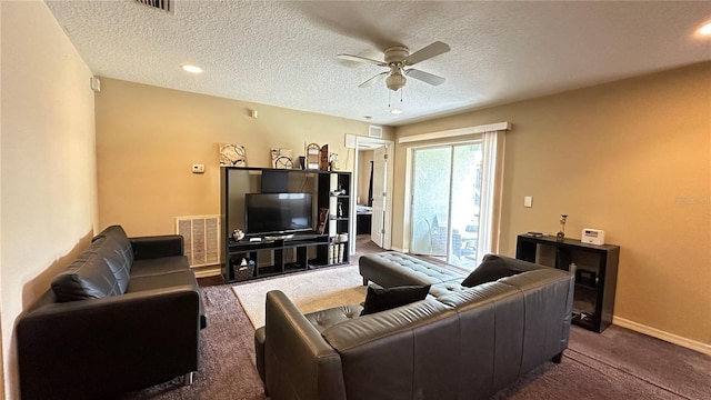 living room featuring dark colored carpet, visible vents, ceiling fan, and baseboards