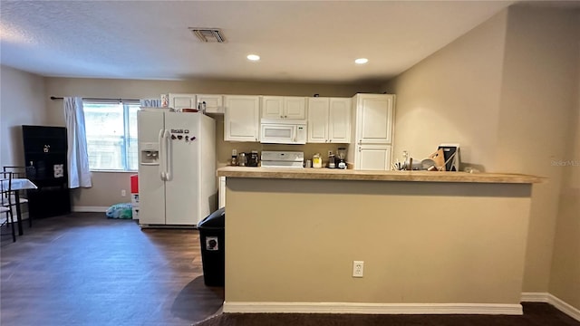 kitchen featuring white appliances, baseboards, visible vents, white cabinets, and light countertops