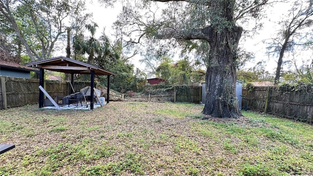 view of yard with a gazebo and a fenced backyard