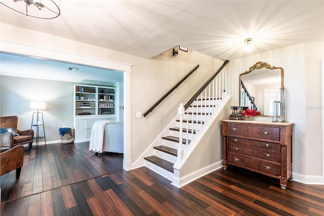 stairs featuring baseboards and wood finished floors