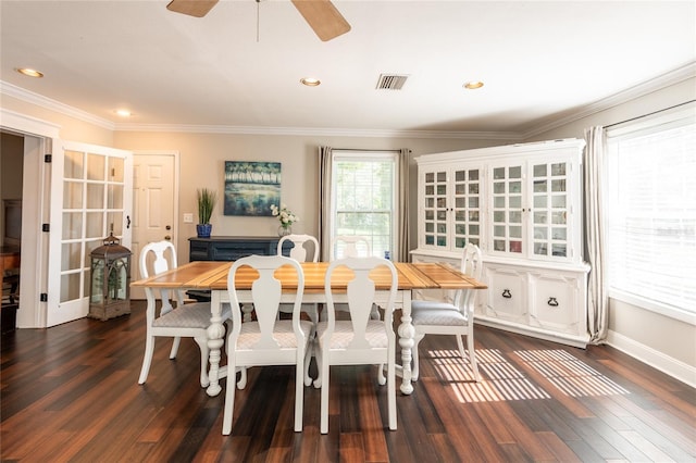 dining area featuring ceiling fan, visible vents, dark wood finished floors, and ornamental molding