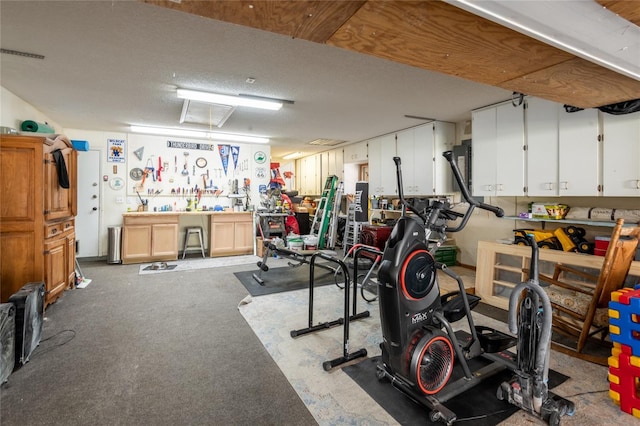 interior space featuring visible vents and a workshop area