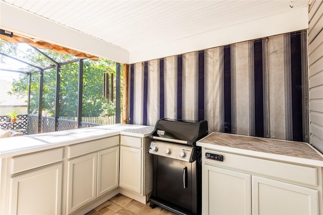 interior space with a sunroom and light countertops