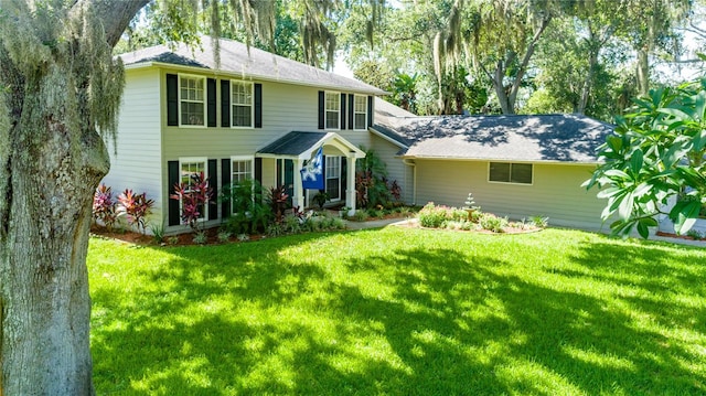 colonial inspired home with a front yard