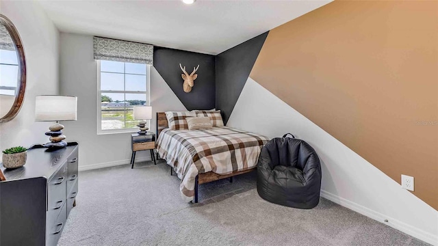 bedroom featuring light carpet