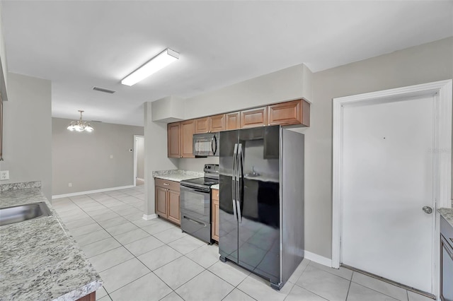 kitchen featuring black appliances, an inviting chandelier, sink, light tile patterned floors, and pendant lighting