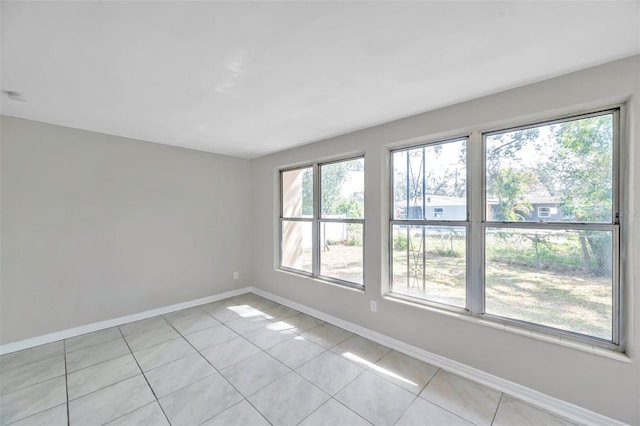 empty room featuring light tile patterned floors