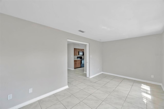 view of tiled spare room