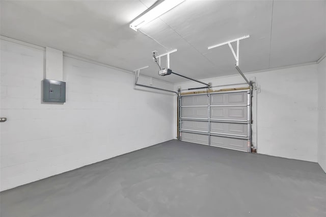 garage with electric panel and a garage door opener