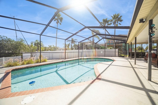 view of pool with a patio area, a lanai, a fenced in pool, and fence