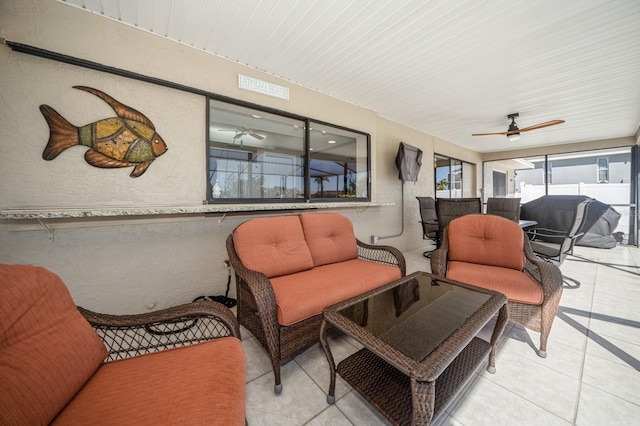 sunroom with a ceiling fan