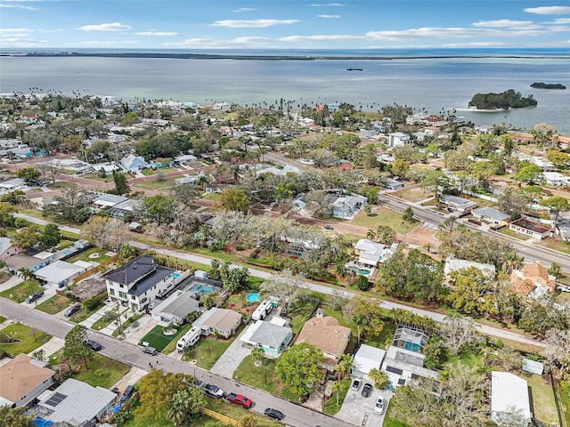 birds eye view of property with a water view and a residential view