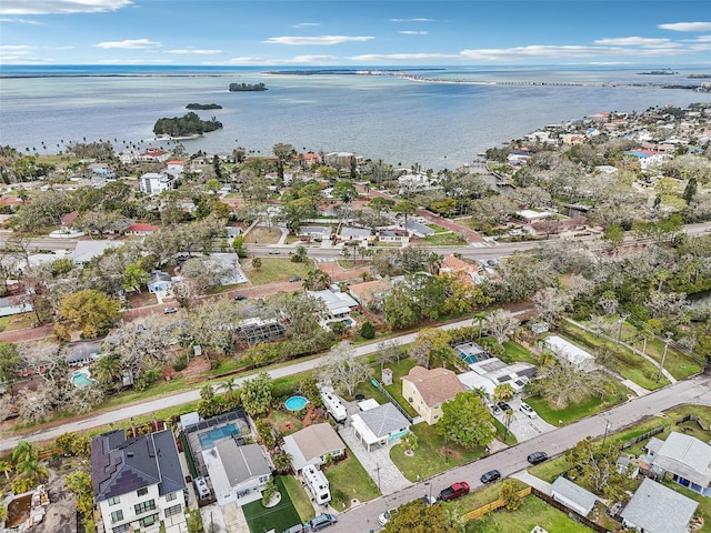 bird's eye view featuring a water view and a residential view