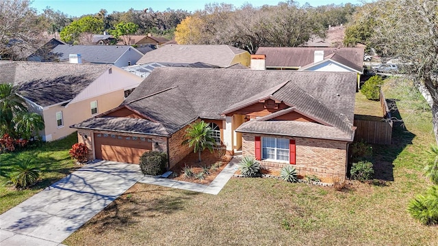 view of front of home with a garage and a front lawn