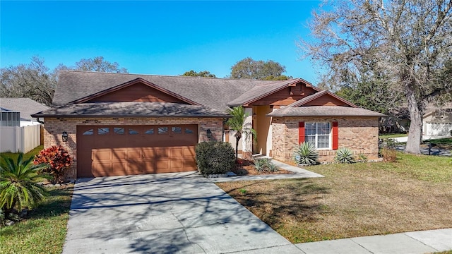 view of front of home featuring a front lawn and a garage