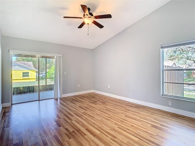 unfurnished room featuring light wood-type flooring, vaulted ceiling, and ceiling fan