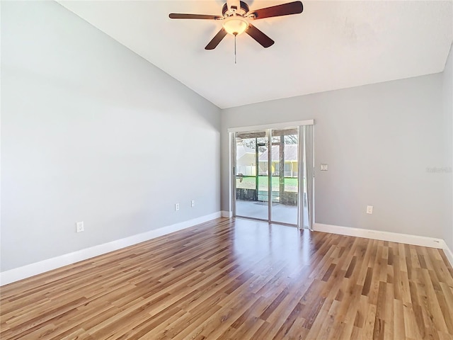 empty room featuring ceiling fan, light hardwood / wood-style flooring, and vaulted ceiling