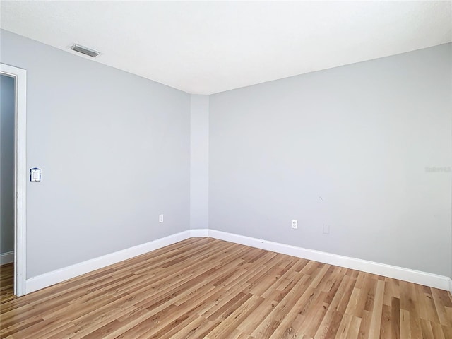 unfurnished room with light hardwood / wood-style flooring