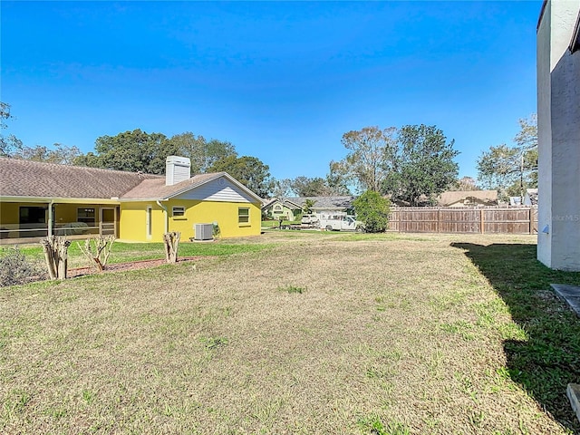 view of yard with central AC