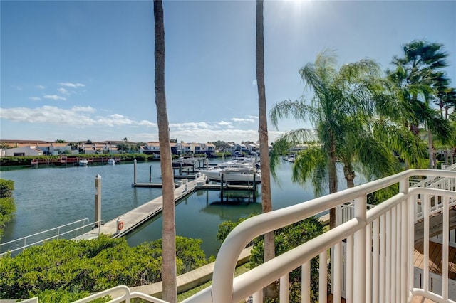 property view of water with a residential view and a dock