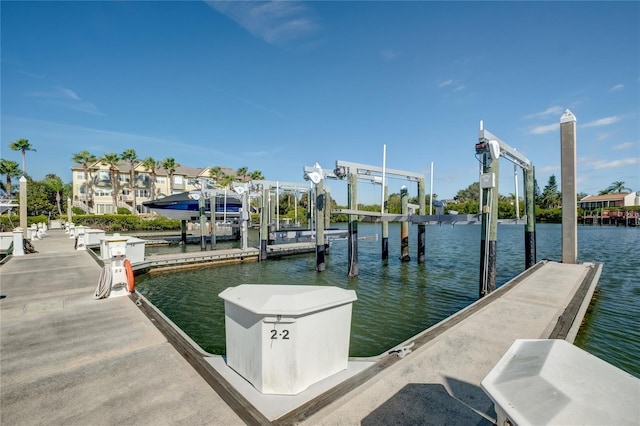 view of dock with a water view and boat lift