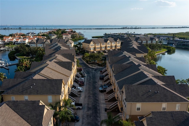 bird's eye view with a water view and a residential view