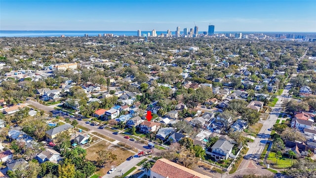 drone / aerial view featuring a water view and a residential view