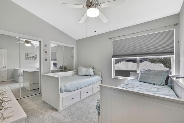 carpeted bedroom featuring ceiling fan and lofted ceiling