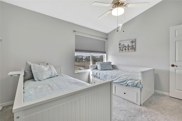 carpeted bedroom featuring lofted ceiling and ceiling fan