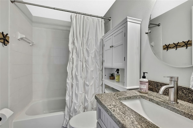 full bathroom with shower / tub combo, vanity, and toilet