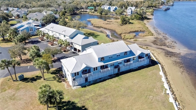 bird's eye view with a water view and a view of the beach