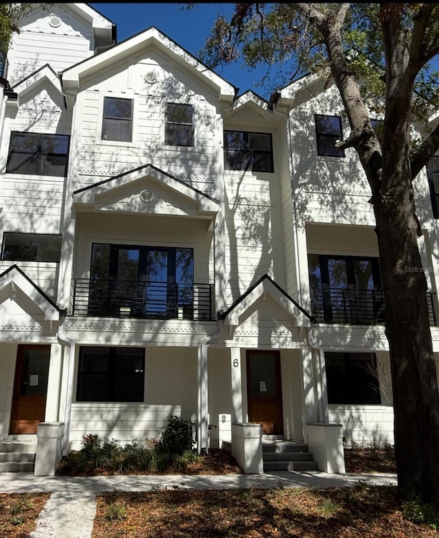 view of front of property with a balcony