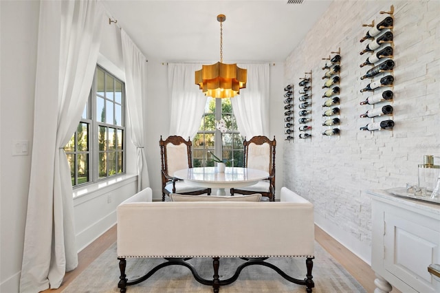 dining space featuring light wood-style floors