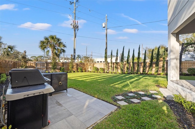 view of yard featuring a patio area and a fenced backyard