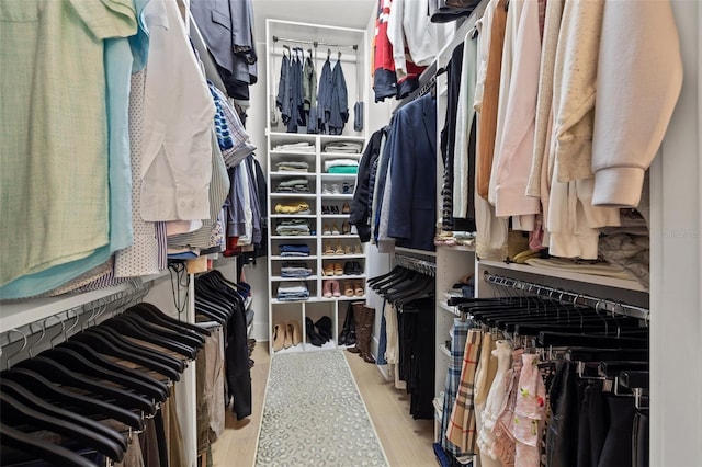 walk in closet featuring light wood-style floors