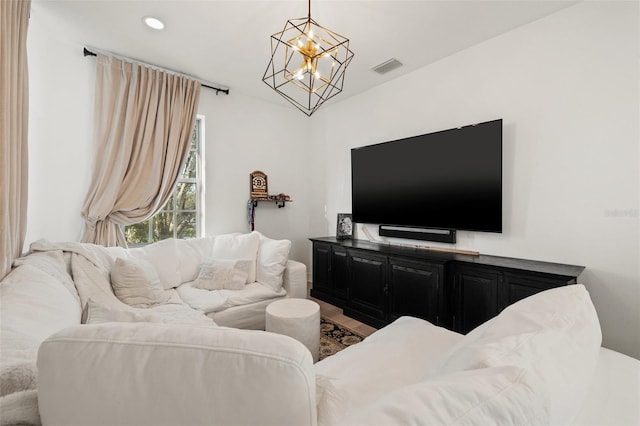 living area featuring a chandelier, visible vents, and recessed lighting