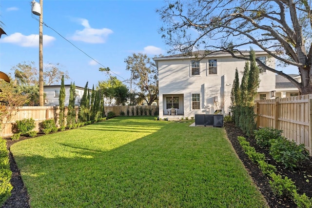 view of yard with a fenced backyard