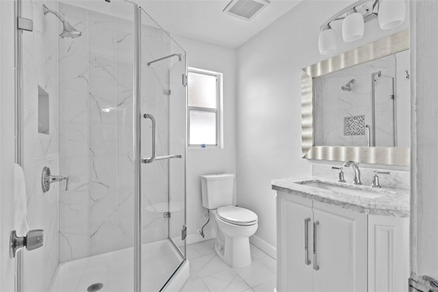 bathroom featuring a marble finish shower, marble finish floor, visible vents, and toilet