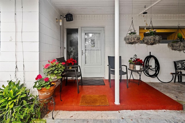 doorway to property featuring a porch