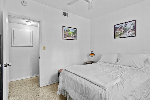 bedroom featuring a ceiling fan, visible vents, baseboards, and speckled floor