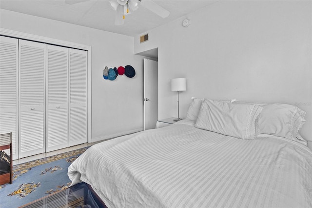 bedroom featuring a closet, visible vents, and a ceiling fan