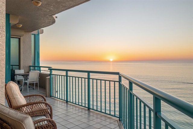 balcony at dusk with a water view