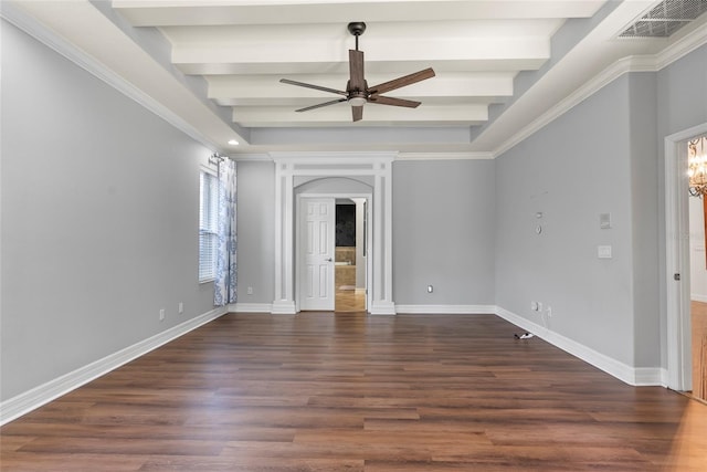 spare room featuring arched walkways, dark wood finished floors, visible vents, and baseboards