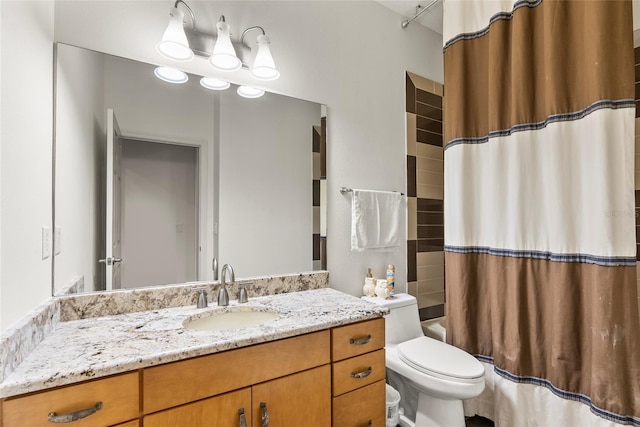 full bath with shower / bath combo, vanity, and toilet