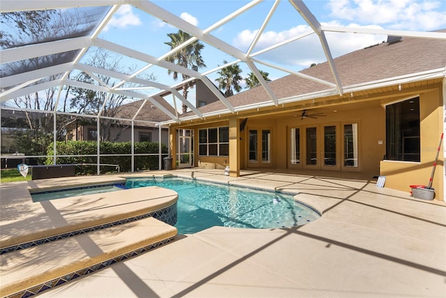 outdoor pool with a patio area, ceiling fan, an outdoor hot tub, and glass enclosure