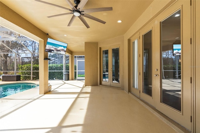 unfurnished sunroom with french doors and a swimming pool